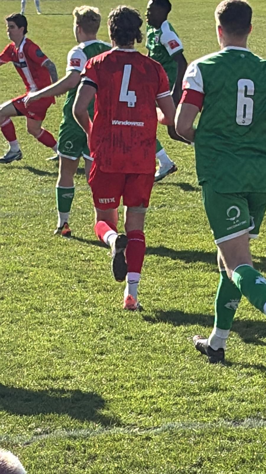 Frome Town player with INTIX on the shorts