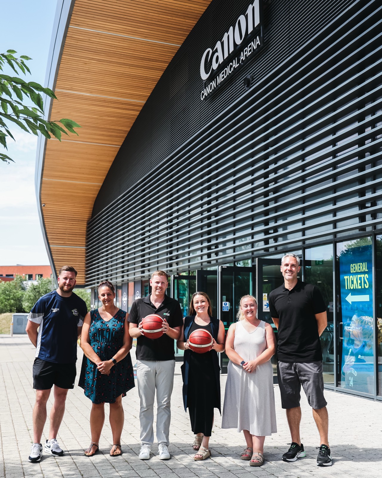 The INTIX and Sheffield Sharks teams outside the Canon Medical Arena